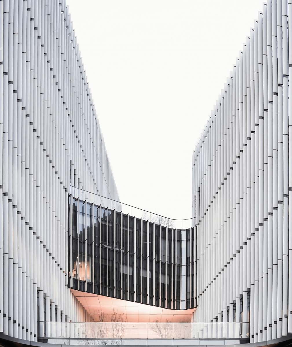 office building gray curtain building during daytime banister